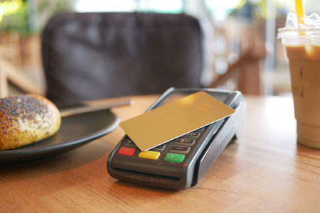 contactless payment concept with young man paying with credit cardの写真素材