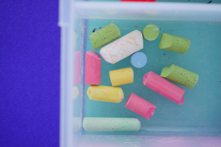 Vibrantly Colorful Chalk Pieces Floating in Water Creating a Stunning Visualの写真素材