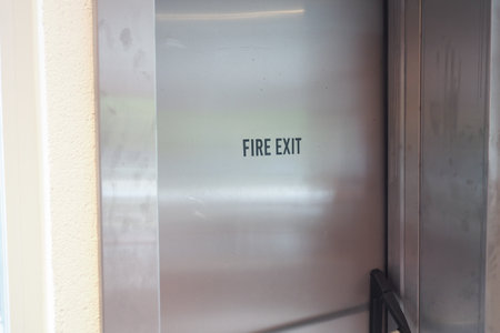 Fire Exit Signage prominently displayed in an Urban Environmentの写真素材