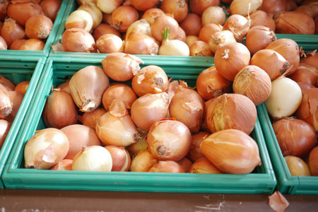 Fresh onions are available at Market Basket Groceryの写真素材