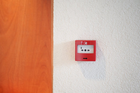 Red fire alarm button on wall ,の写真素材