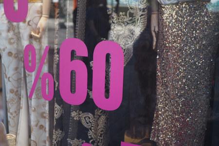 A Massive and EyeCatching 60 Discount Sign in Fashion Store Window Displayの写真素材