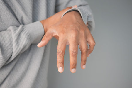 man suffering pain in hand close up