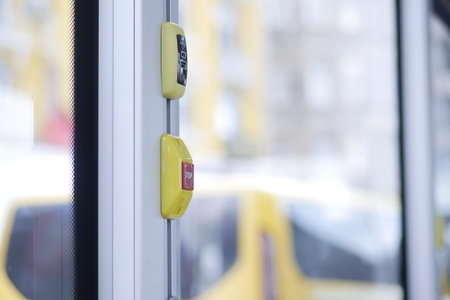 Closeup of Bus bell switch for stop inside the public bus