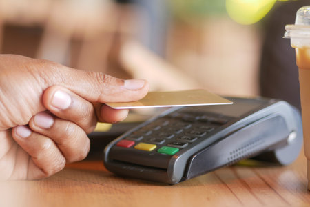 contactless payment concept with young man paying with credit card