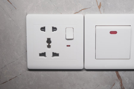 A Contemporary Modern Electrical Power Outlet and Switch Installed on Wallの写真素材