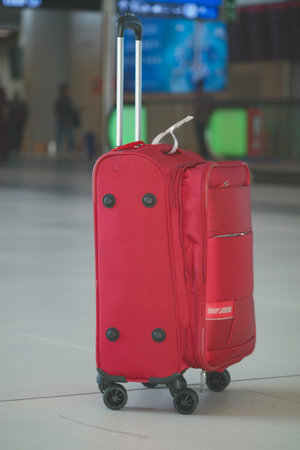The vibrant and colorful luggage available at the bustling airport terminal is truly eyecatchingの写真素材