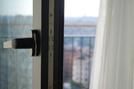 Contemporary Modern Balcony Door Handle Featuring an Inspiring Urban View