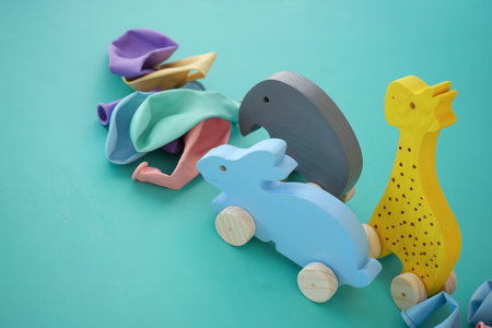 Colorful Wooden Animal Toys Displayed Beautifully on a Bright Blue Background