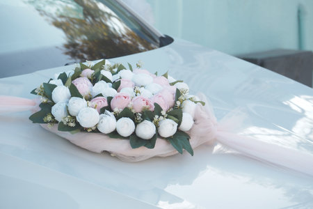 Stunning and Elegant Floral Decoration Artfully Designed for Wedding Carの写真素材