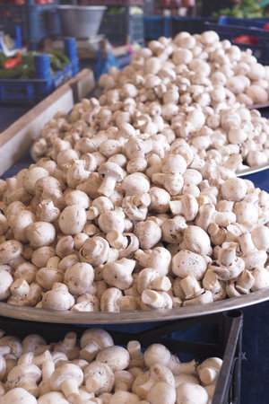 A vibrant display of fresh mushrooms presented beautifully at the market stallの写真素材
