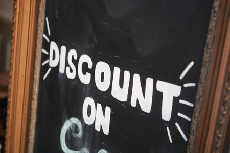 A Chalkboard Sign That Clearly Announces a Discount on Delicious Coffee
