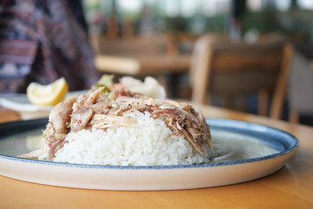 Boiled chicken, steamed rice, pink plate.の写真素材