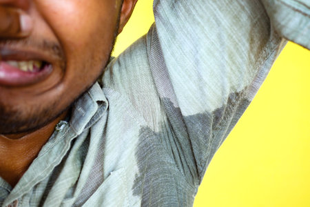 man with wet armpits Smelly odor from sweat .