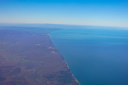 Aerial View of the Beautiful Coastal Landscape and Surrounding Ocean Watersの写真素材