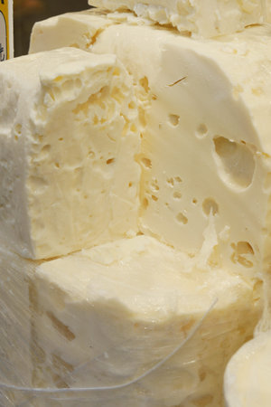many type of cheeses on shop window
