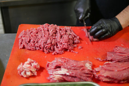 Freshly Chopped Raw Meat Placed Neatly on a Cutting Board Ready for Useの写真素材