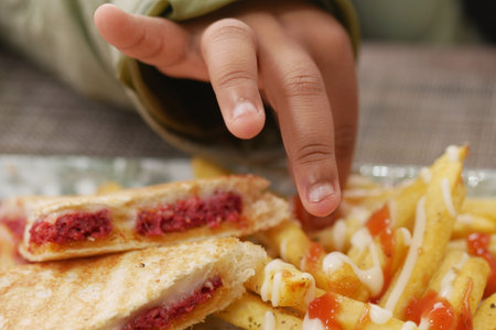 child eating french fries close upの写真素材