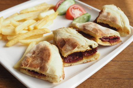 Tasty sandwiches with crispy fries and fresh veggiesの写真素材