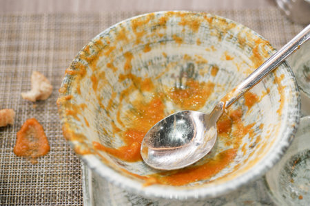 Finished meal leaves empty bowl on tableの写真素材