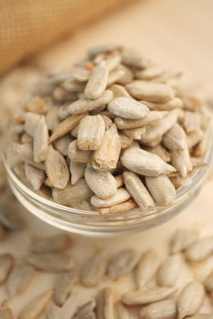 Healthy sunflower seeds in a glass bowlの写真素材