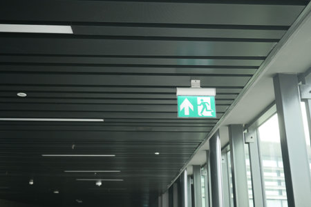 Exit sign indicating emergency route in a modern building