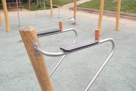 Outdoor fitness equipment at a community park in the daytime