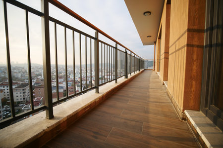 Expansive city view from a contemporary balcony in the eveningの写真素材