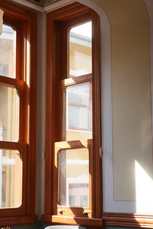 Natural light streaming through wooden windows in a cozy interior