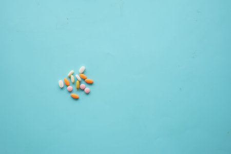 An Array of Assorted Vitamins and Medications Displayed on a Bright blue Surface