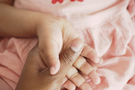 father holding hand of baby child,の写真素材