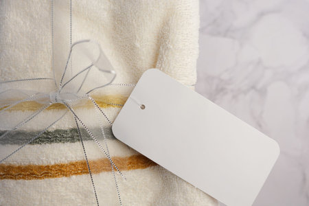 Soft and plush Towels featuring a lovely Decorative Tag, perfect for enhancing Home Decorの写真素材