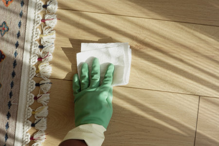 Cleaning the Floors with Green Gloves Creating a Bright, Inviting, and Cheerful Sceneの写真素材