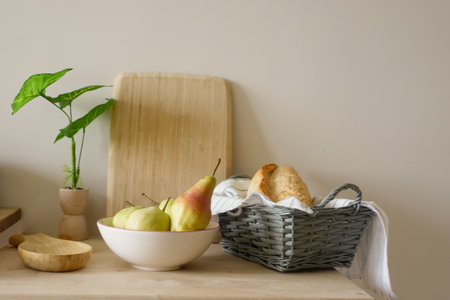 Fresh fruits and baked goods arranged on a kitchen counterの写真素材