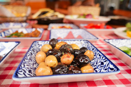 Colorful assortment of olives and appetizers on a festive tableの写真素材