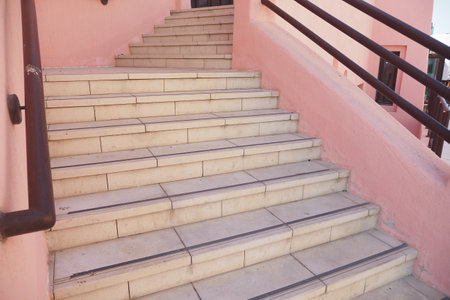 Steps leading to a vibrant building in a sunny locationの写真素材