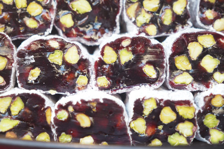 Colorful Turkish delight with pistachios displayed in a market
