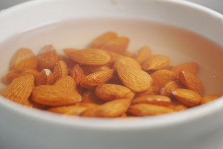 Soaking almonds to enhance flavor and texture in culinary preparationの写真素材