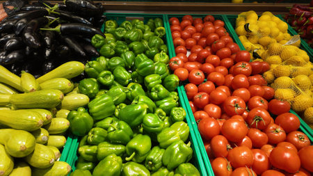 Fresh vegetables displayed in a market with vibrant colorsの写真素材