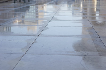 Reflections on a wet marble floor after a summer rain showerの写真素材