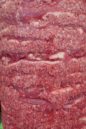 Freshly prepared ground beef ready for cooking at a local marketの写真素材