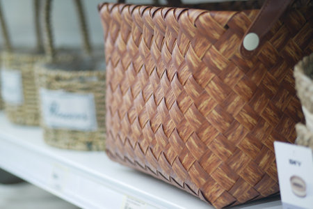 Handcrafted woven baskets displayed in a local craft shopの写真素材