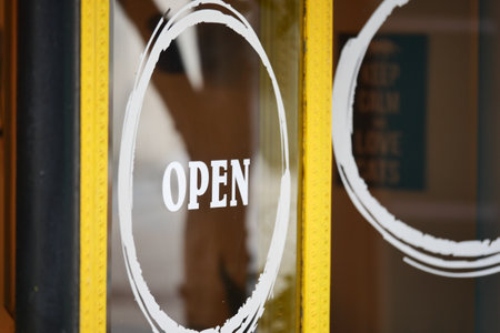 Open door welcoming visitors to a lively establishment in the cityの写真素材