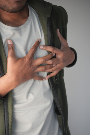 young man suffering heart attack