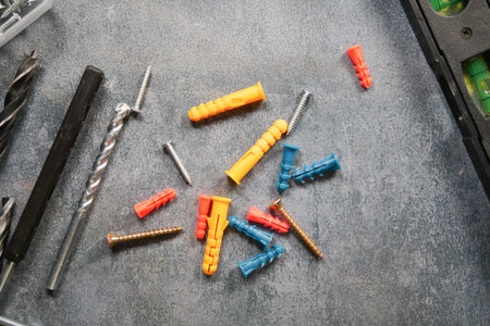 Variety of screws and anchors scattered on a work surface