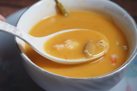 Rich and hearty seafood soup served in a bowl for dinnerの写真素材