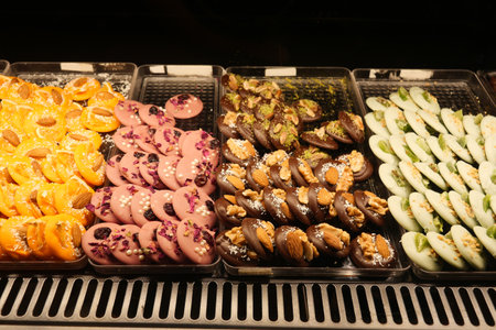 Colorful assortment of traditional sweets displayed in a market stallの写真素材