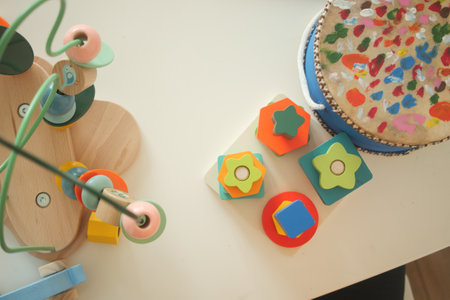 Colorful wooden toys and crafts in a playful setting for childrenの写真素材