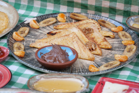 Delicious breakfast plate featuring French toast and fresh fruitの写真素材