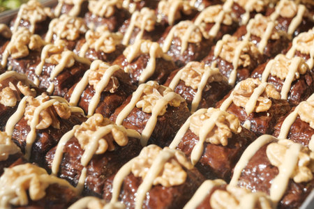 Delicious turkish baklava decorated with creamy topping and nutsの写真素材